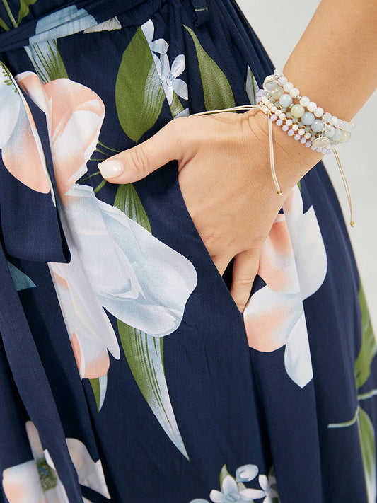 Floral Pocket Belted Ruffle Hem Halter Neck Dress